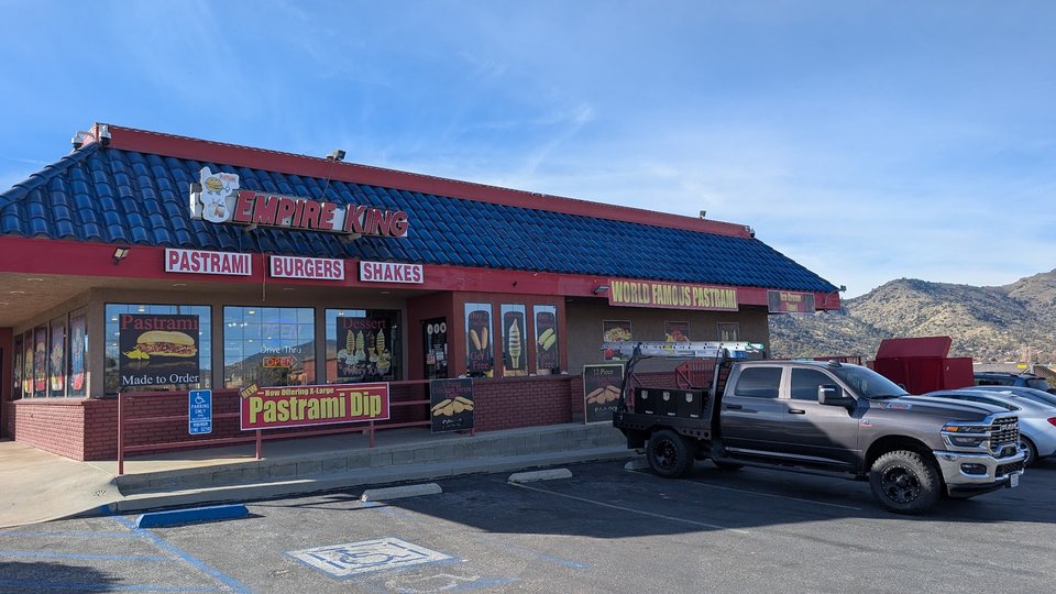 Fast food counter with seating nearby.